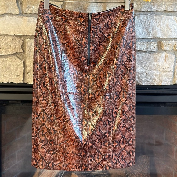 EXPRESS x Negin Mirsalehi ($88)
Vegan Leather Snakeskin Print Midi
Skirt size 6 - Picture 9 of 11